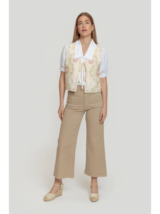 Chaleco beige bordado con lazada